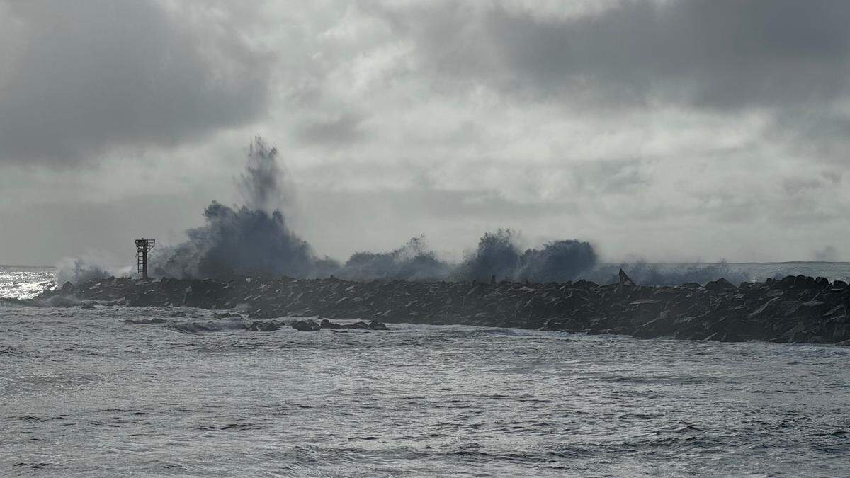 Powerful waves crash over the breakwater in Morro Bay on Saturday, Dec. 30, 2023.