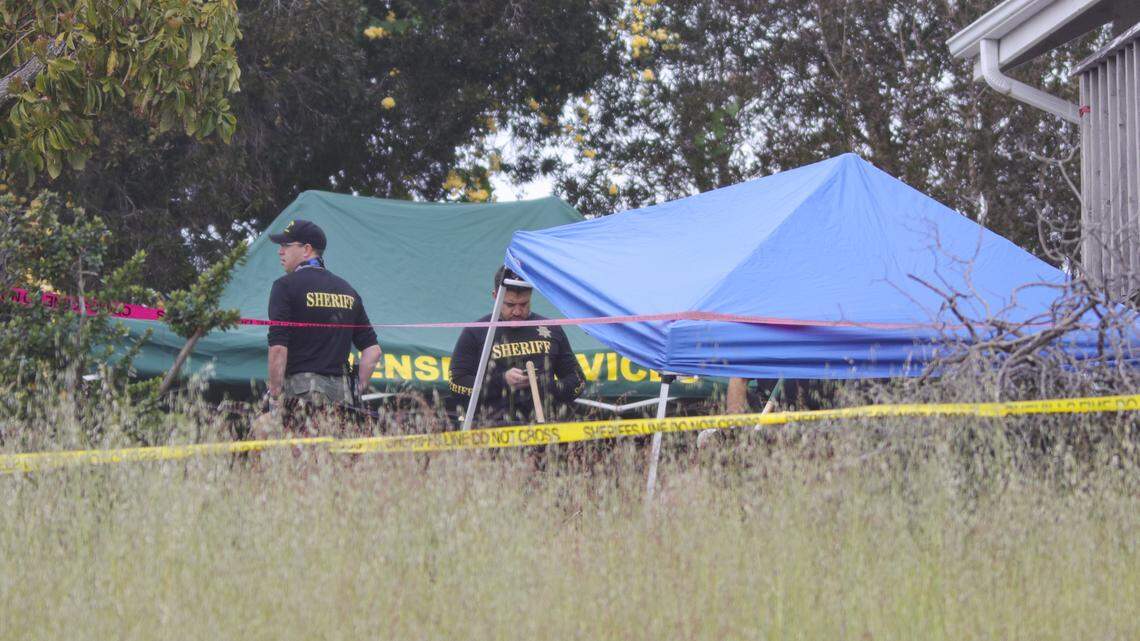 A green Forensic Services tent can be seen next to a blue tent in the backyard of Ruben Flores’ Arroyo Grande home during a search on Tuesday, April 13, 2021, in the Kristin Smart murder case. Investigators said in court documents that they “are in possession of biological evidence that makes them believe the victim was buried underneath (Ruben Flores’) deck at one time.”