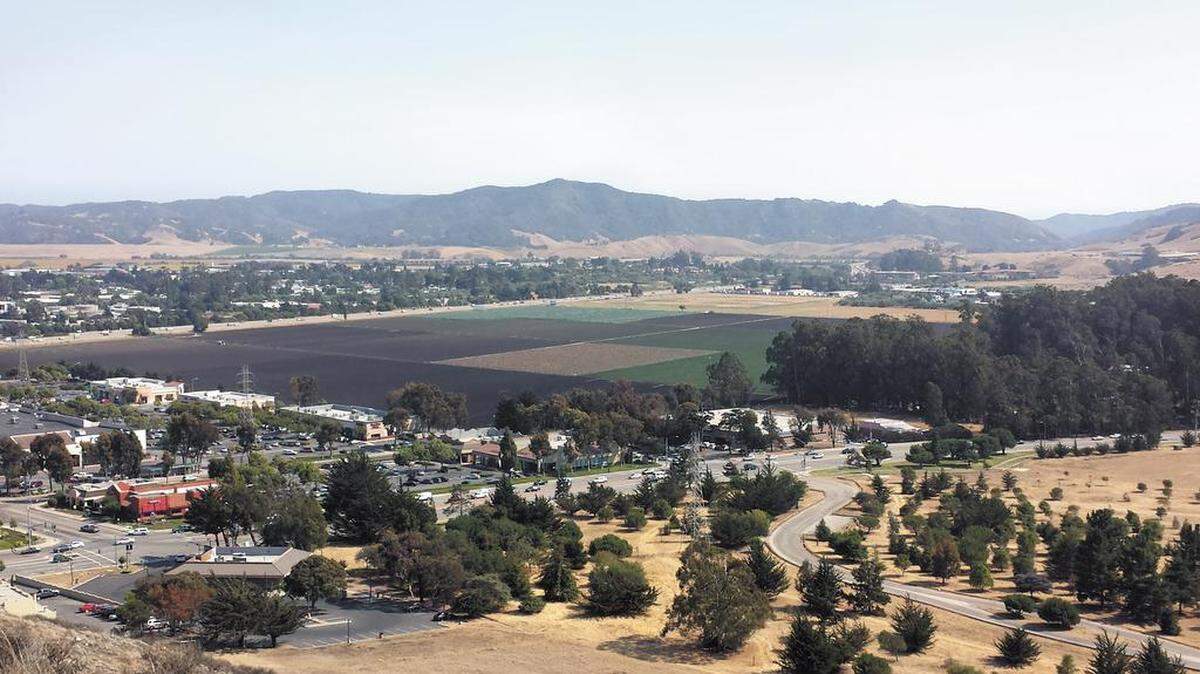 In a view from the hill adjacent to Laguna Lake Park, the former Dalidio Ranch property reaches from the edge of the SLO Promenade to Highway 101.