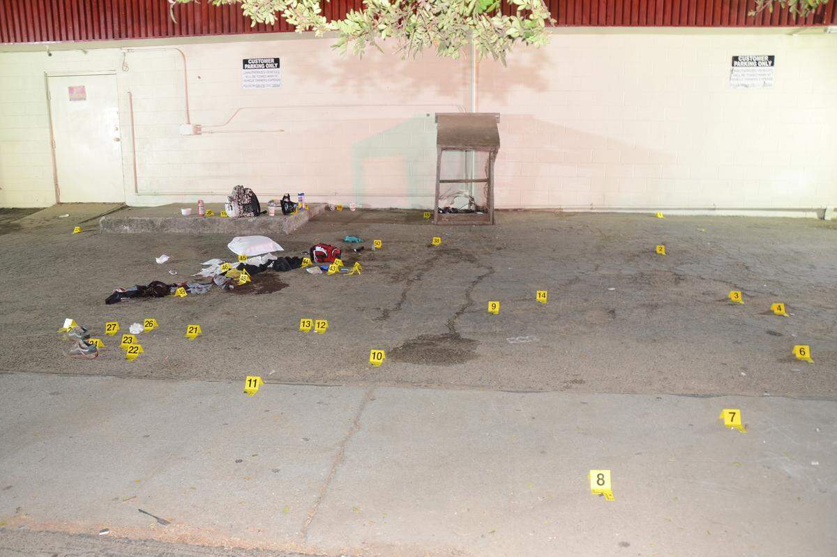Evidence markers dot an area at the scene of shootings later linked to the MS-13 gang in Santa Maria.