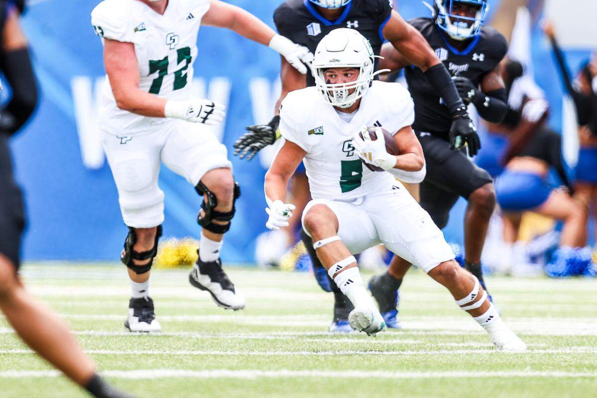 Cal Poly Mustangs running back Aiden Ramos (5) rushes up the middle in Cal Poly’s 59-3 loss to San Jose State at CEFCU Stadium in San Jose on Sept. 9, 2023.