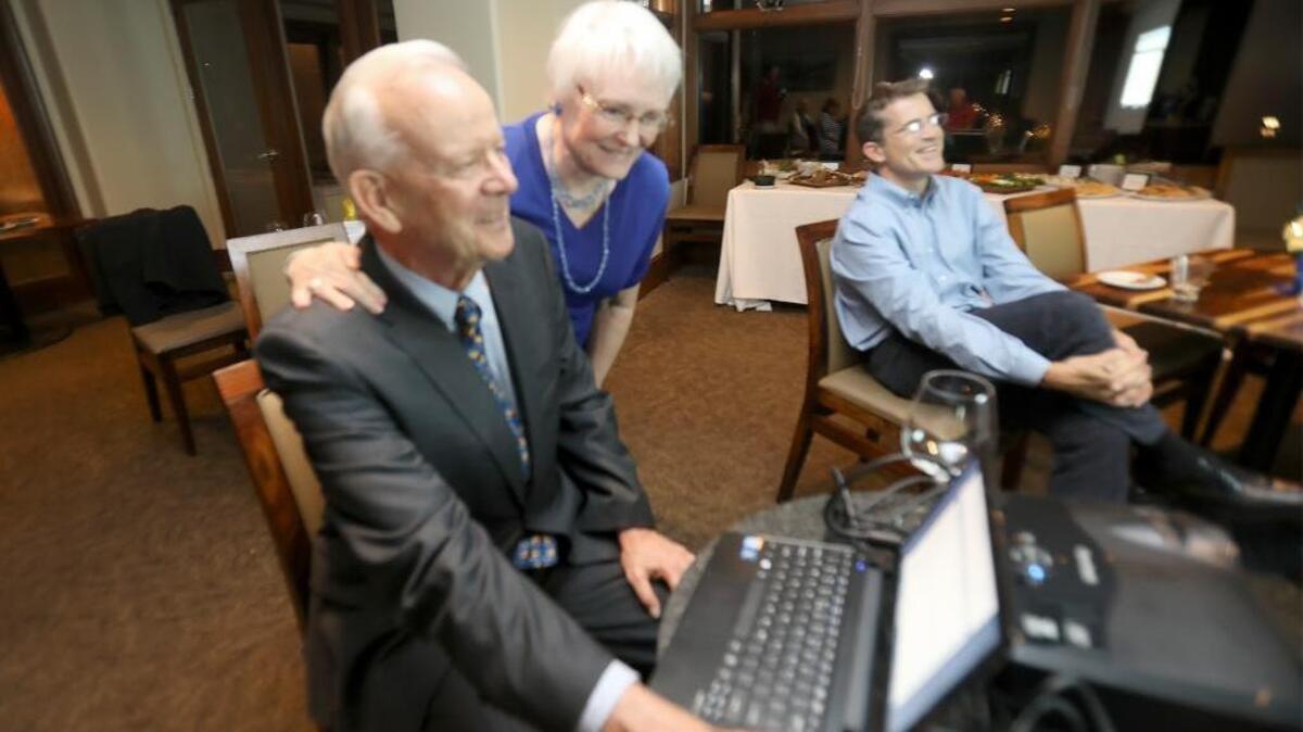 Ed Waage and his wife, Jeannie, look over results in Pismo Beach.