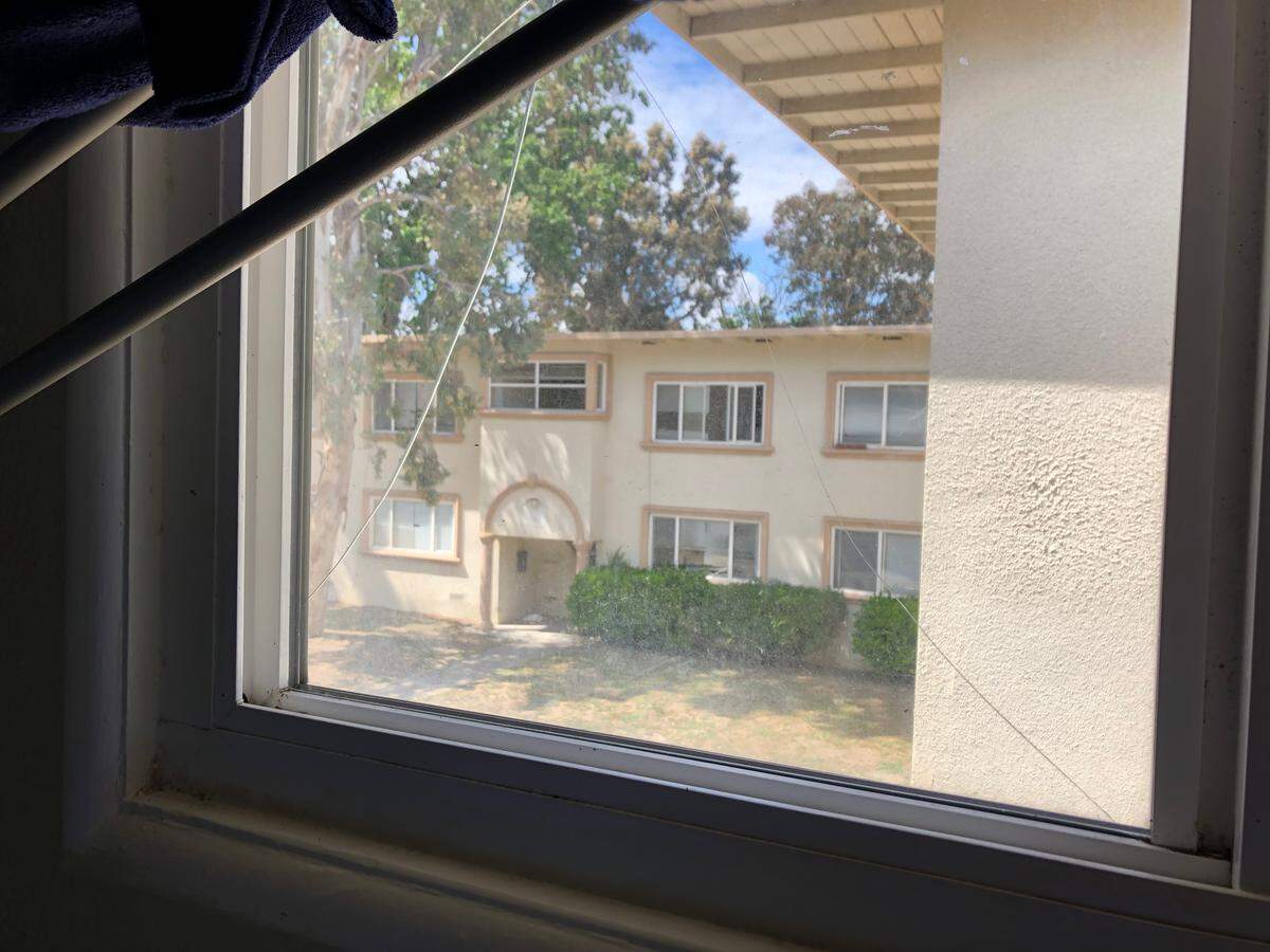 A broken bedroom window in a Grand View Apartments resident’s unit.