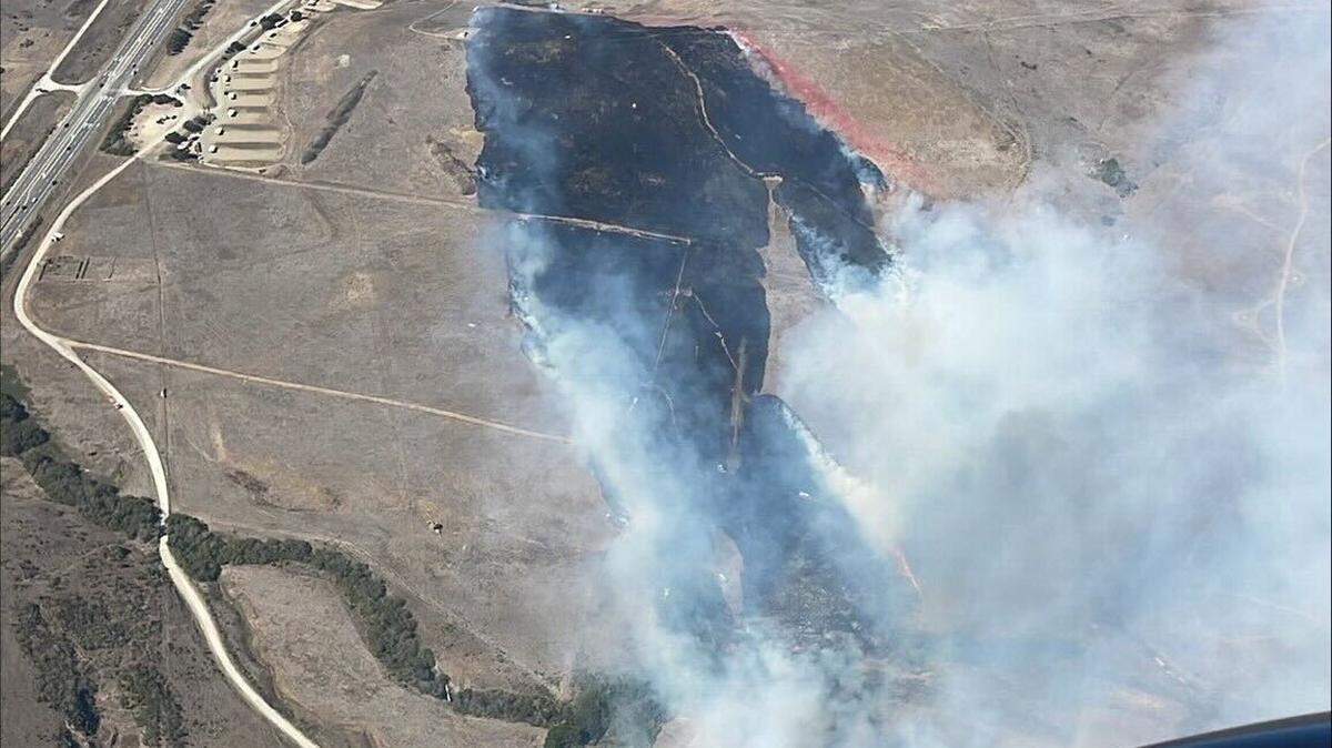 A fire burned 50 acres along Highway 1 outside of San Luis Obispo on Oct. 19, 2024, as seen overhead from Cal Fire airplane.