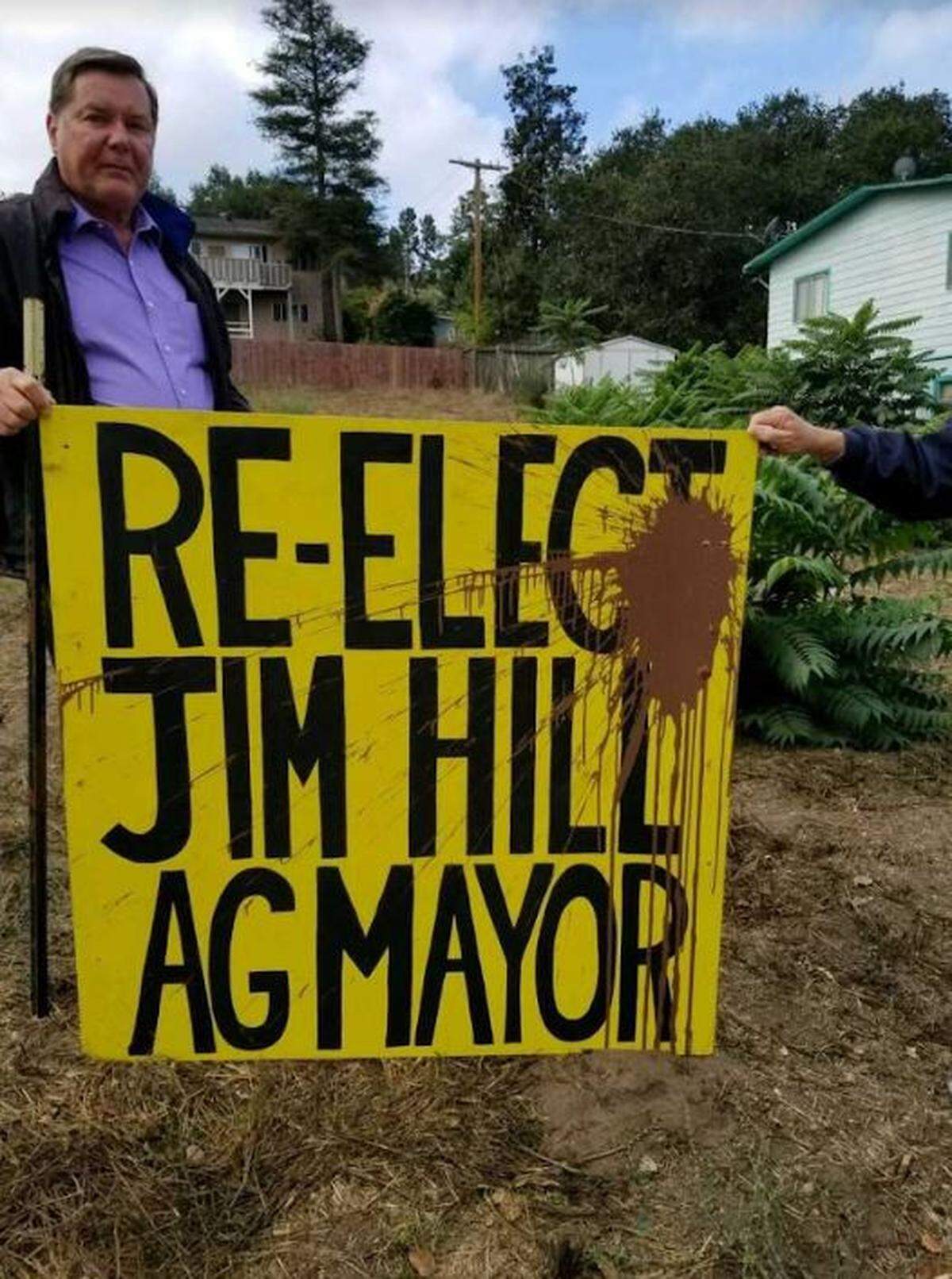 Brown paint splotches one of Arroyo Grande Mayor Jim Hill’s campaign signs. Police say about a dozen of the signs were vandalized.