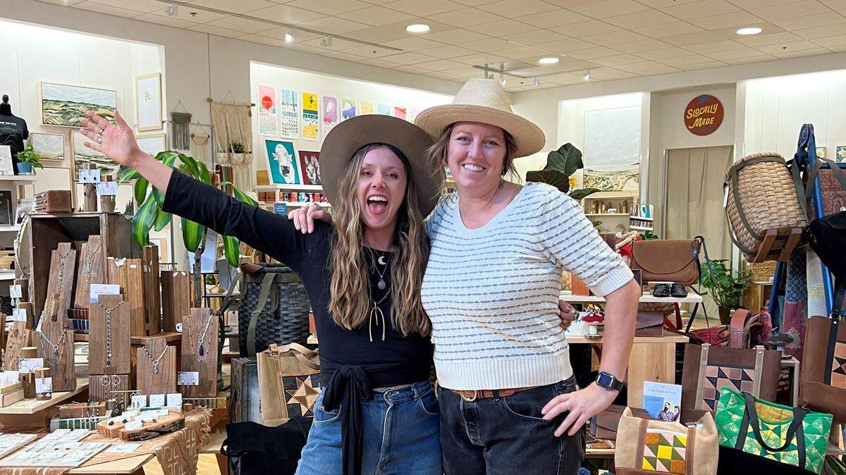 Sadie Rogers and Kerry Long pose for a photo on the opening night of SLOcally Made in December 2022.