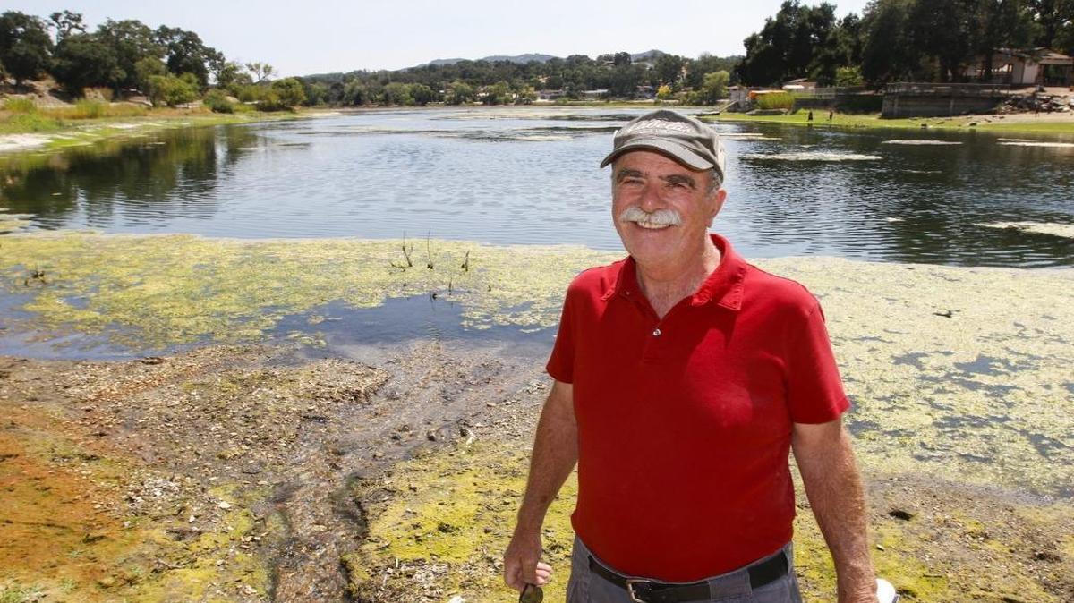 Paul Murphy, president of Friends of Atascadero Lake, stands in front of the lake. His organization raised money for a pipeline to channel well water into Atascadero Lake to add to its water supply and offset evaporation.