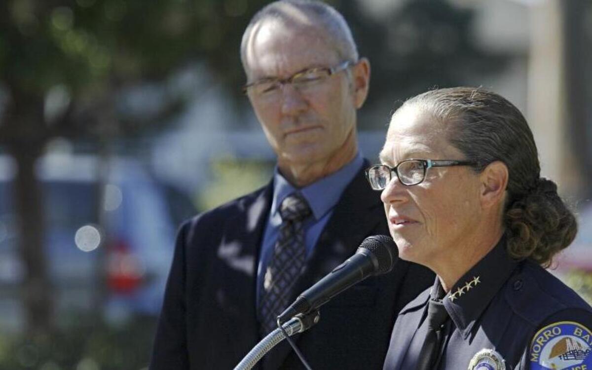 Morro Bay police Chief Amy Christey speaks next to Mayor Jamie Irons at a briefing on an officer-involved shooting October 30, 2015. Although the city was to consider a plan to outsource police services in 2017, the departure this week of Christey, who recently accepted a position in Pacific Grove, caused city staff to bring the issue to the table earlier.