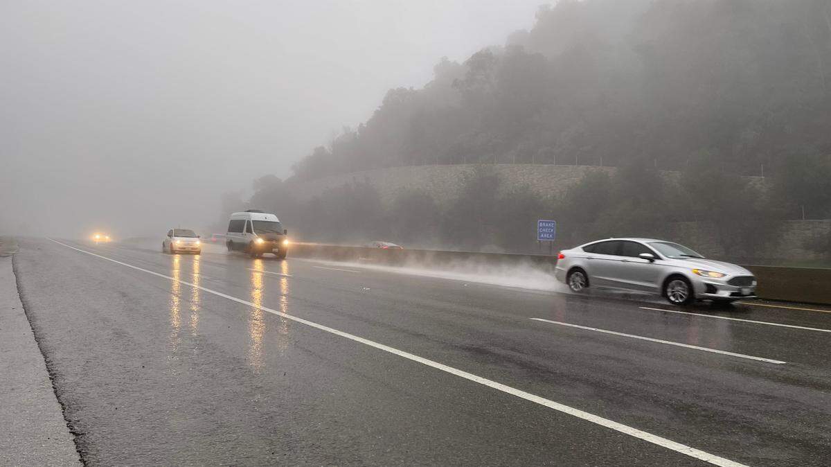 Northbound traffic on Highway 101 moves slowly over the Cuesta Grade on Saturday afternoon as a storm brought heavy rain and high winds to San Luis Obispo County on Dec. 10, 2022.