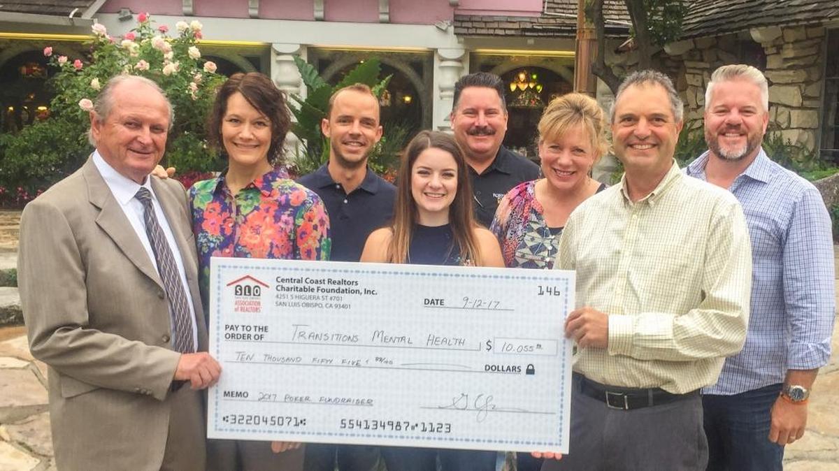Individuals celebrate Central Coast Realtors® Charitable Foundation’s donation to Transitions Mental Health Association. From left, TMHA board member Casey Appell, TMHA Executive Director Jill Bolster-White, CCRCF President Graham Updegrove, CCRCF Events Committee chair Sarah Hudson, CCRCF director Robin Foreman, CCRCF Stacy Axan, TMHA division director Frank Ricceri and CCRCF director Chris Strand.