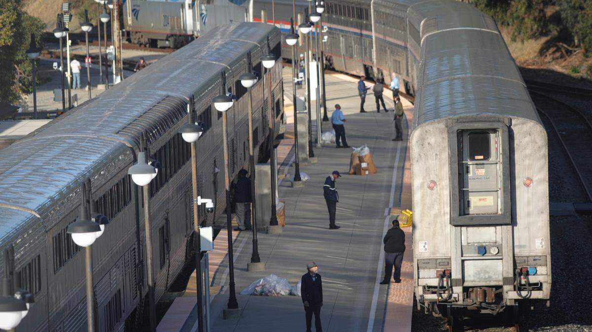 North and southbound Coast Starlight Amtrak trains stop in San Luis Obispo as passengers and crew step outside for a moment before departure on Nov. 30, 2023.