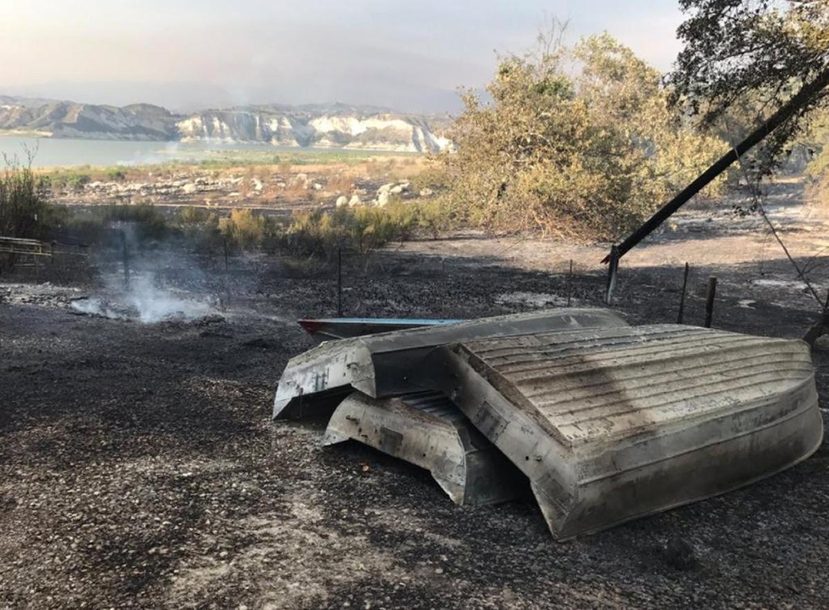 Damaged boats as flames from the Whittier Fire jumped Highway 154 and burned a small part of the Cachuma Lake Campground on Saturday.