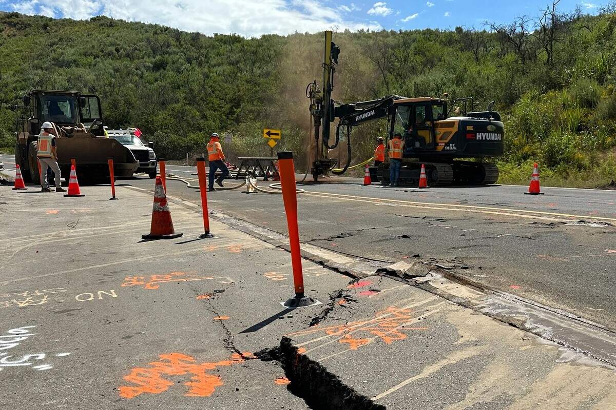 Crews work to repair Highway 154 near San Antonio Creek Road on Sunday after implementing a complete closure a day earlier when damage worsened.