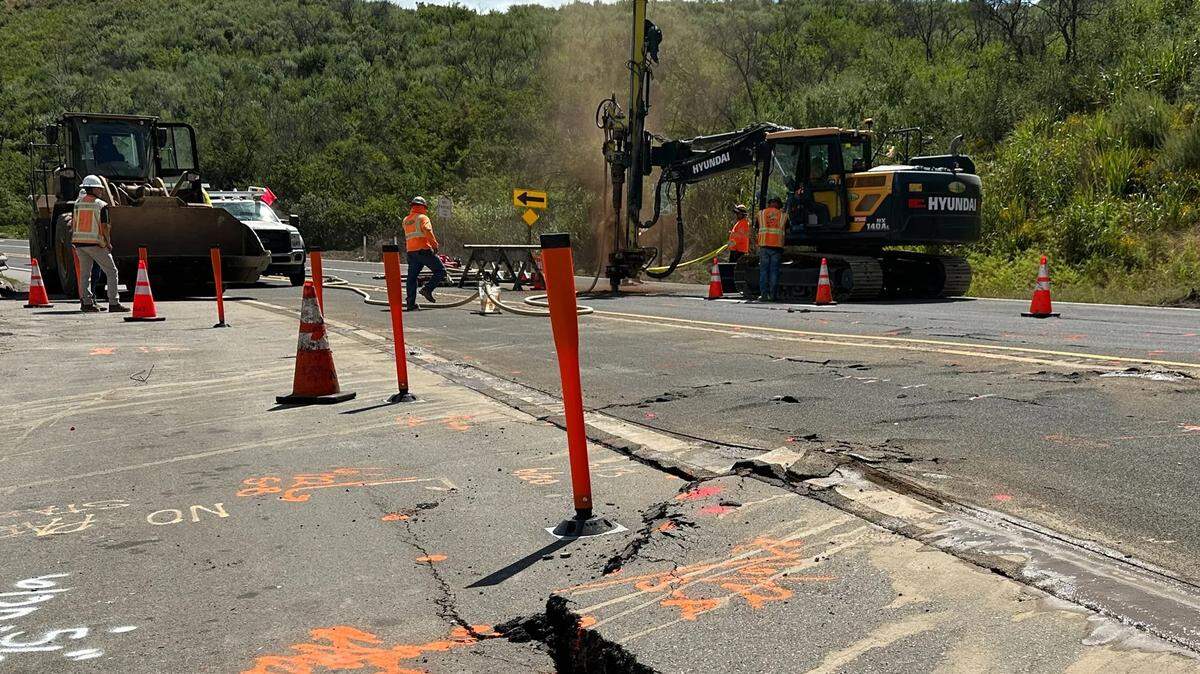 Crews work to repair Highway 154 near San Antonio Creek Road on Sunday after implementing a complete closure a day earlier when damage worsened.