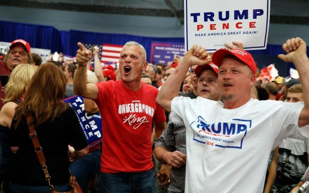 Joe Bokun of Churchville, Pa., left, screams at reporters Friday during remarks by Republican presidential candidate Donald Trump at a campaign rally in Newtown, Pa.