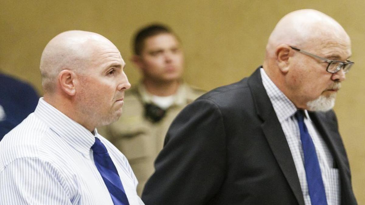 Former Salinas Valley State Prison guard Travis Woolf, left, stands with his lawyer Ilan Funke-Bilu as he listens to the reading of the verdict acquitting him of manslaughter in the death of Alvaro Medrano following a fight outside the Elkhorn Bar in San Miguel on Sept. 7, 2014.