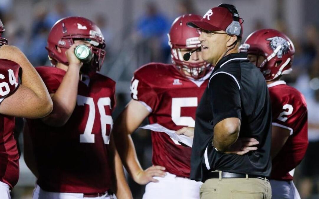 Rich Schimke talks to Paso Robles High football players during a game against Clovis North in September.