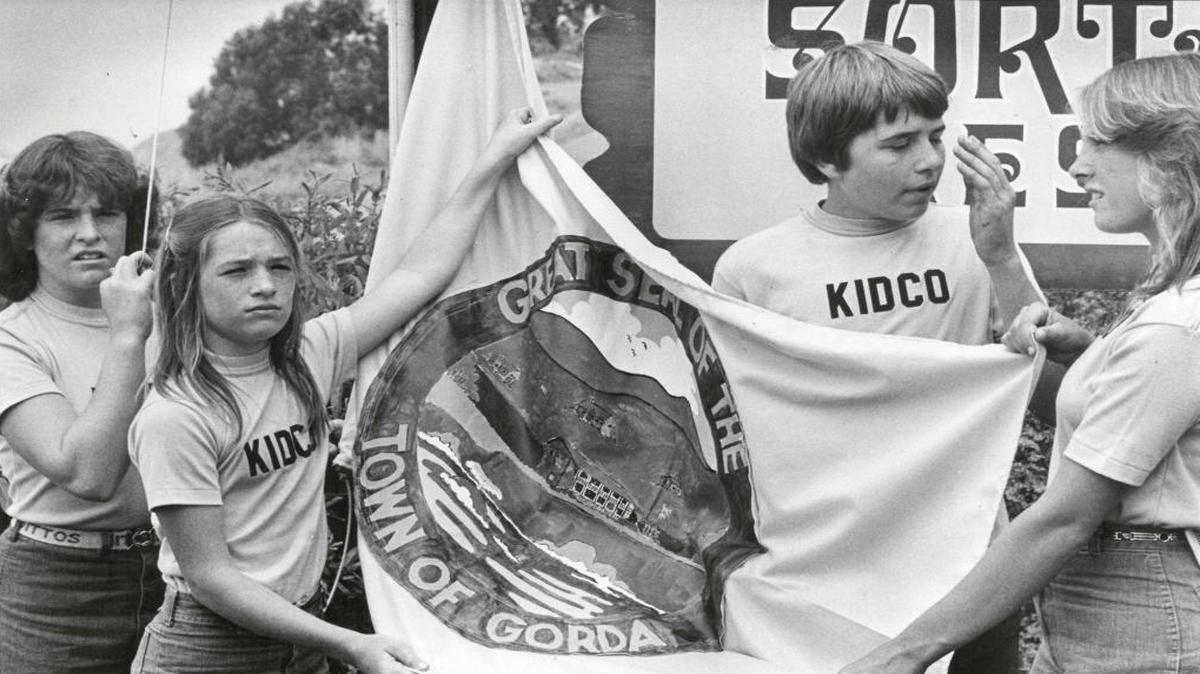 Kidco's young executives show off the flag of Gorda. Bette, 12, NeNe, 11, Dickie, 14 and June Cessna, 16 bought the Big Sur coast town.