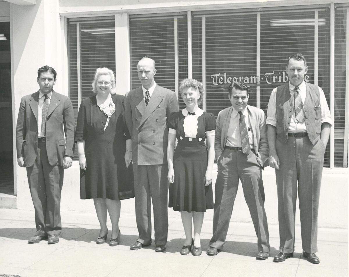 Longtime Telegram-Tribune newsmen Bob Goodell, right, and John Sarber, second from right, gather for a staff photo outside the newspaper’s office at 1240 Morro St. in San Luis Obispo, a former Ford Model T dealership. The photo, courtesy of the Goodell family, was published in a May 11, 1993, 125th anniversary edition.
