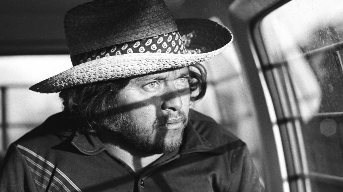 Jesus Ramirez Rivera, 25, waits in a Border Patrol van after being detained in San Luis Obispo for the second time in two weeks in March 1980.