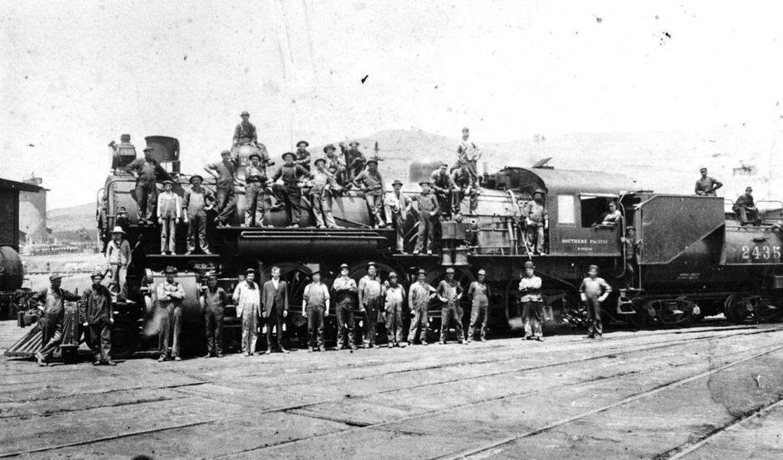 The roundhouse crew of the Southern Pacific Railroad in San Luis Obispo gathers to have its picture taken when this new engine arrived to be put into service in 1913.