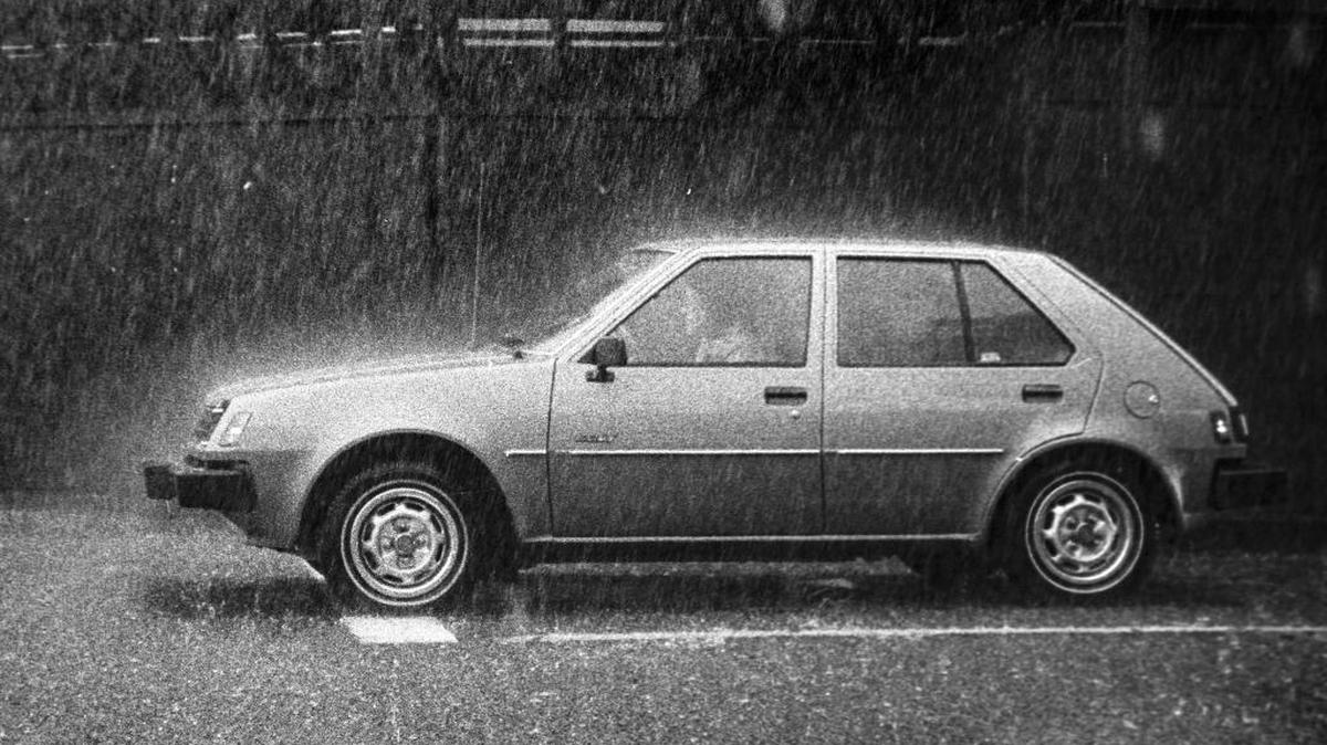 A driver maneuvers cautiously on Morro Street during one of the torrential downpours that caused flooding and power outages throughout San Luis Obispo County in December 1982.