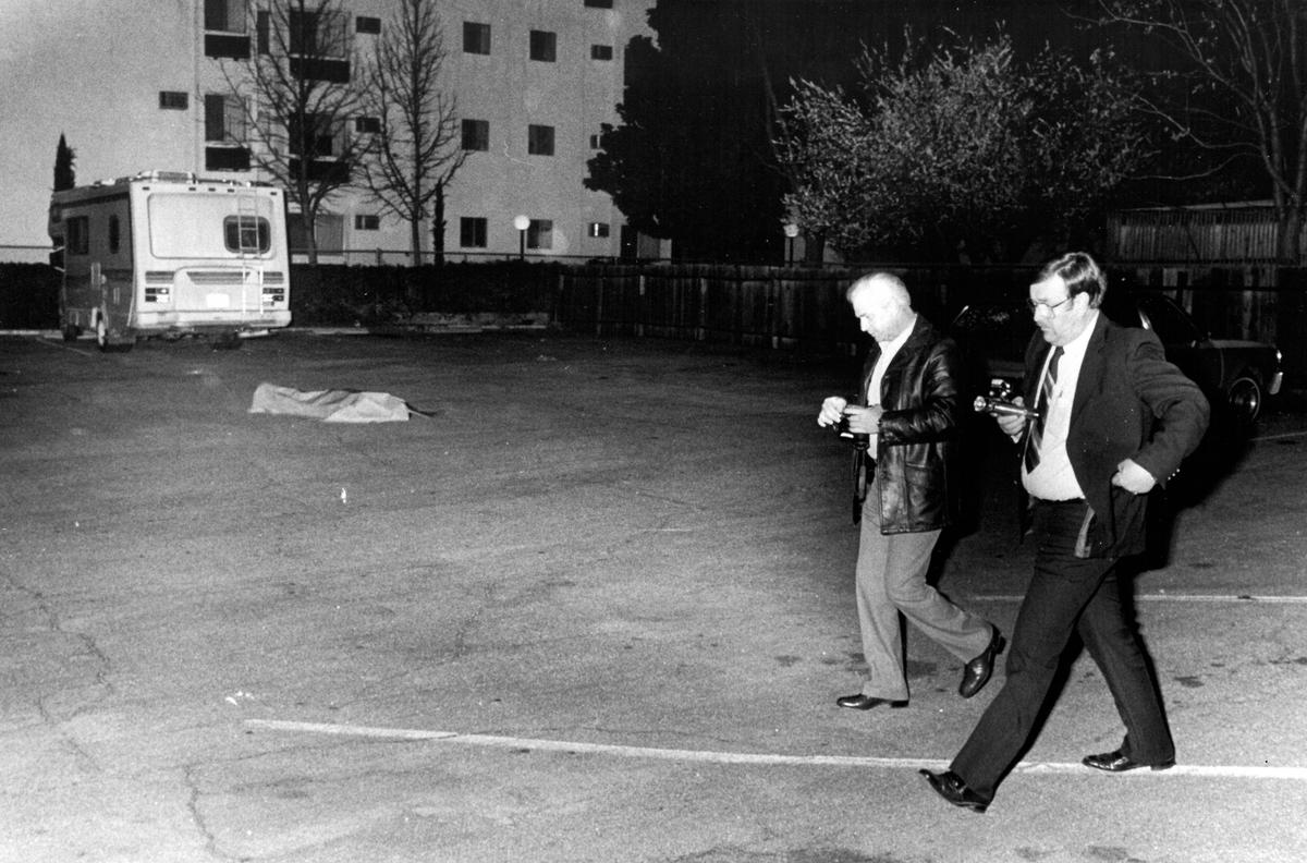 Investigators at the Paso Robles Municipal Court parking lot March 2, 1987 shortly after a gun battle killed with police killed Barbara Veilleux and Michael Anthony Rachelli.