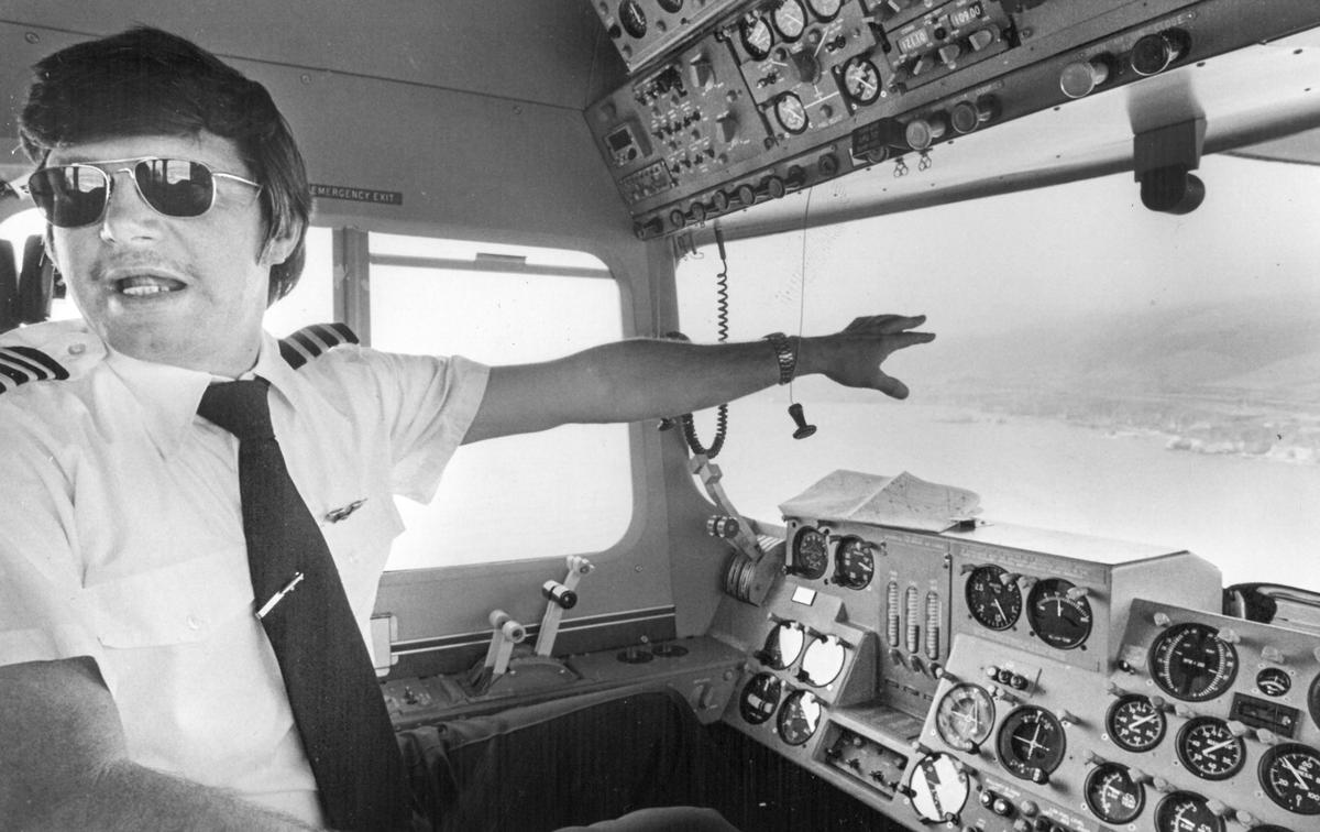 Goodyear blimp pilot Tom Matus points out the view from the gondola.