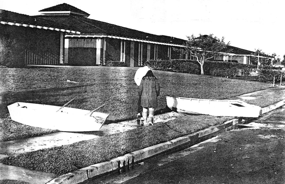 Boats parked on the C.L. Smith school lawn the day after the flood. Jan. 18, 1973.