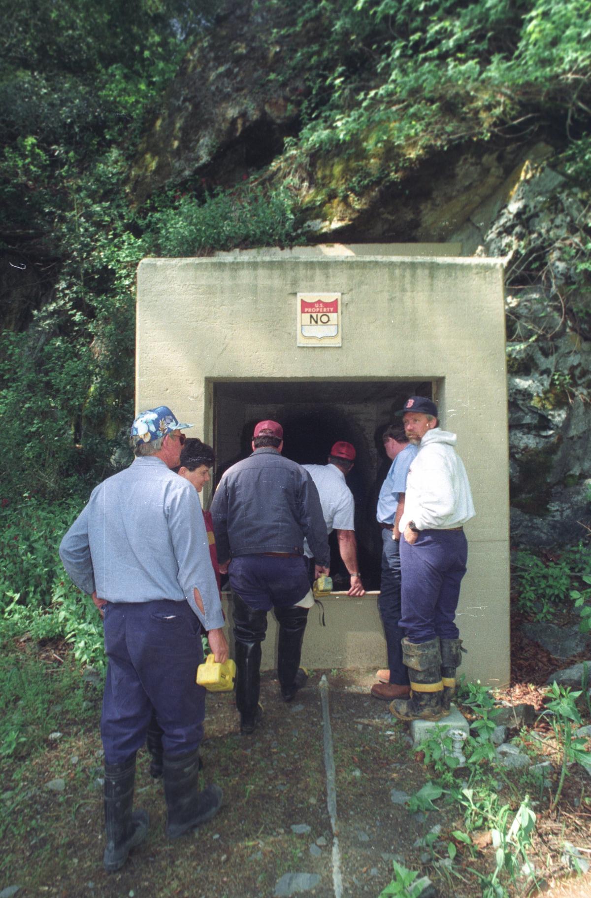 Wearing waders, city crews enter north side of the Cuesta Tunnel in 1994. The tunnel carries water from Salinas Reservoir to San Luis Obispo.
