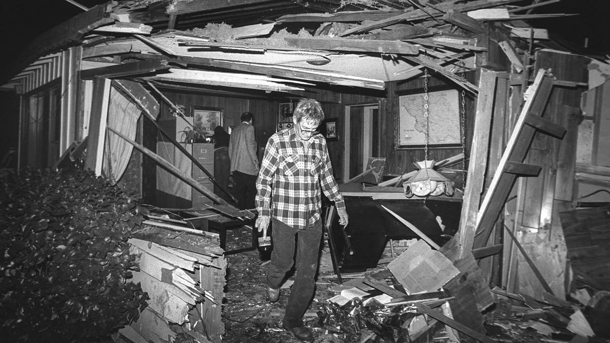 Ken Van Valer walks out of the ruins of a office that was destroyed by a fatal semi-trailer truck crash on the Cuesta Grade near San Luis Obispo in 1984.