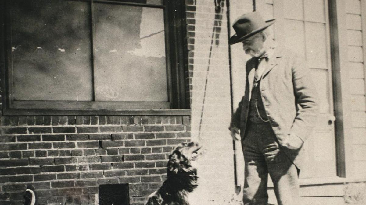 George Stanford, editor of San Luis Obispo Breeze and Tribune, founder of the Oakland Tribune. This photo was circa 1899 in front of the Breeze newspaper office with his dog Ring.
