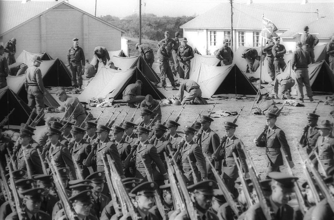 Fort Ord training for San Luis Obispo County recruits. Soldiers march past pup tents at the Monterey area training facility Oct. 16, 1966.