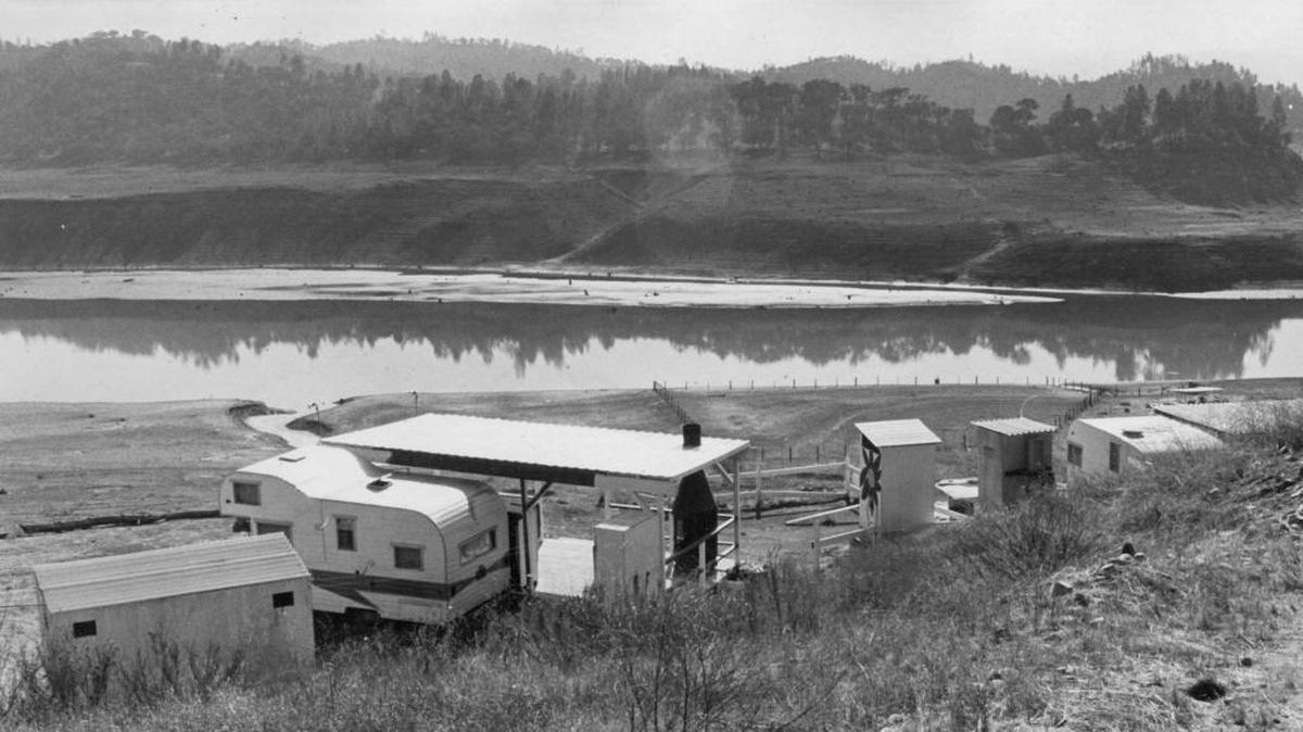 Nacimiento Lake "campsites" in November 1969 featured outdoor toilets and travel trailers under makeshift sheds.