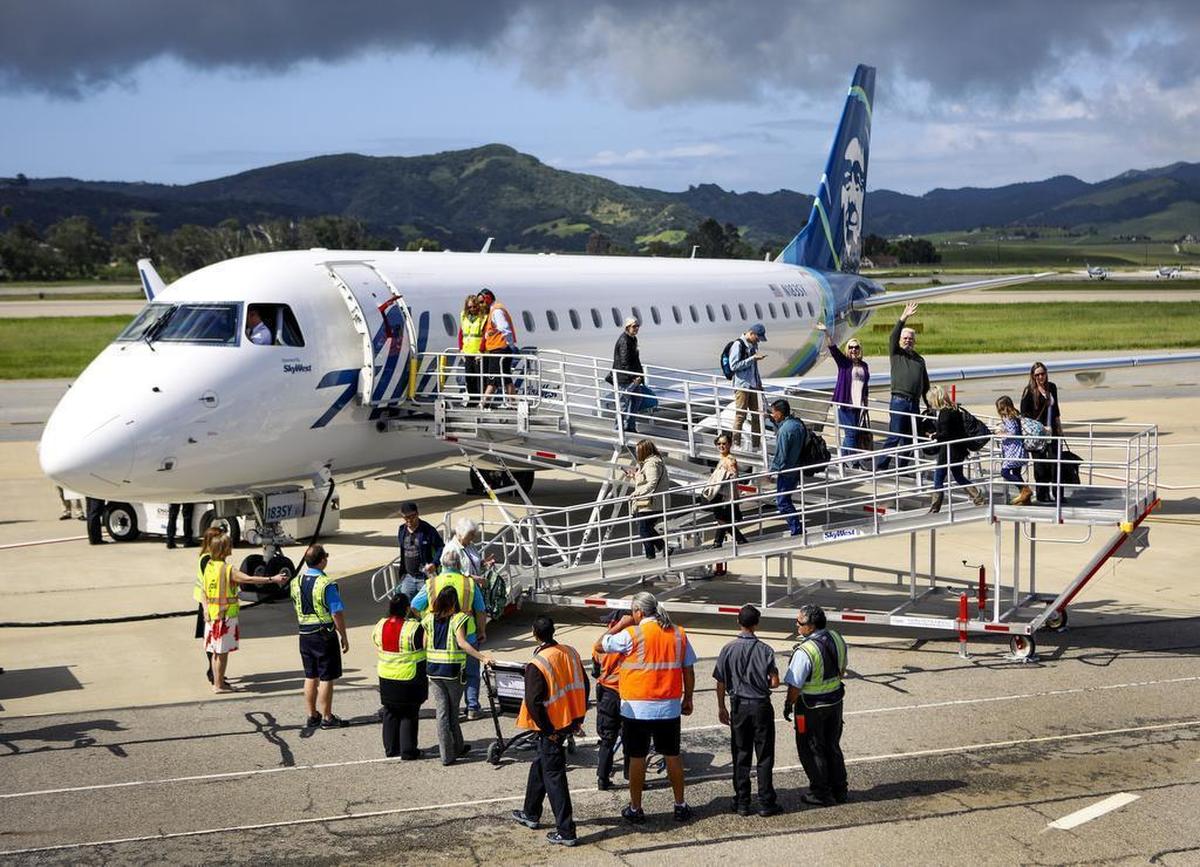 Passengers deplane the first Alaskan Airlines flight from Seattle shortly after it arrived at the San Luis Obispo airport Thursday, April 13, 2017.