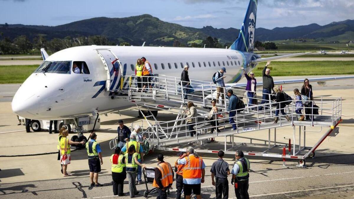 Passengers deplane the first Alaskan Airlines flight from Seattle shortly after it arrived at the San Luis Obispo airport Thursday, April 13, 2017. The airline is adding twice-daily service between Seattle and SLO and is launching its Portland and San Diego flights as well.