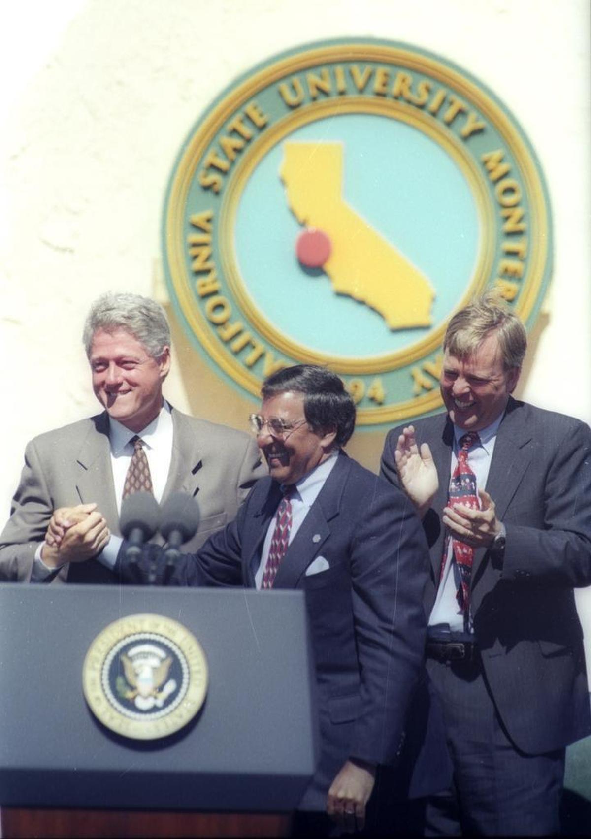 In a Sept. 4, 1995, photo, White House Chief of Staff Leon Panetta, center, introduces President Bill Clinton at the dedication of Cal State Monterey Bay. At right is Cal State Monterey Bay’s president, Peter Smith.