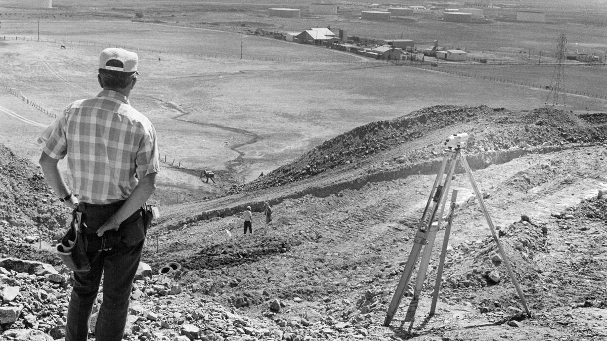 George Hill of San Luis Obispo engineering firm Jennings Bartlett and Associates gazes toward Tank Farm Road from the site of the new reservoir in September 1974. The old Union Oil tank farm can be seen at upper right.