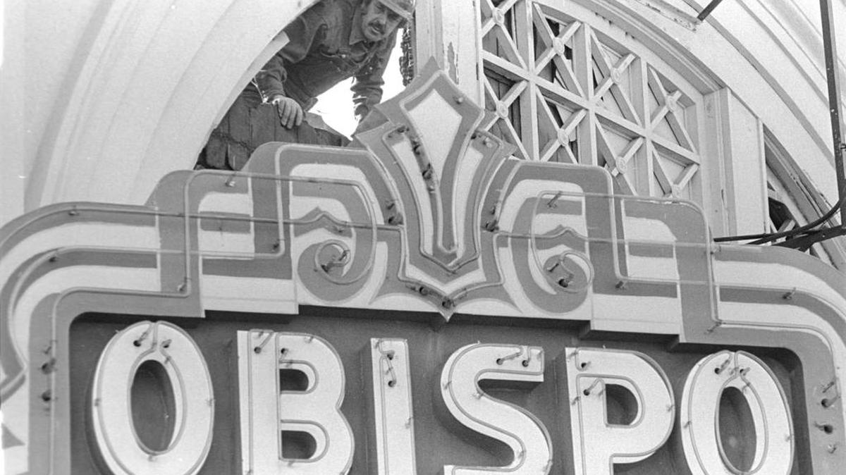 Workmen prepare to lower the Obispo Theater marquee. It opened as the El Monterey in Dec. 26, 1911, and reopened as the Obispo on Dec. 31, 1928; the theater burned Dec. 28, 1975.