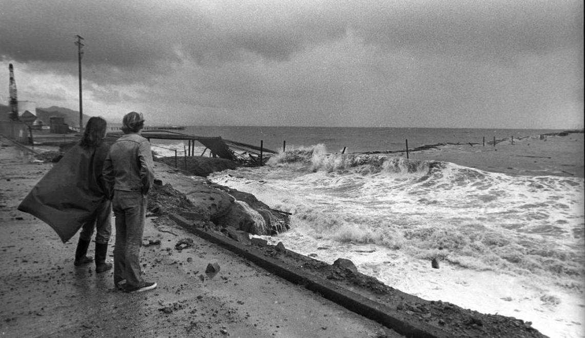 Spectators survey the demolished Union Oil Pier in Avila Beach on March 1, 1983.