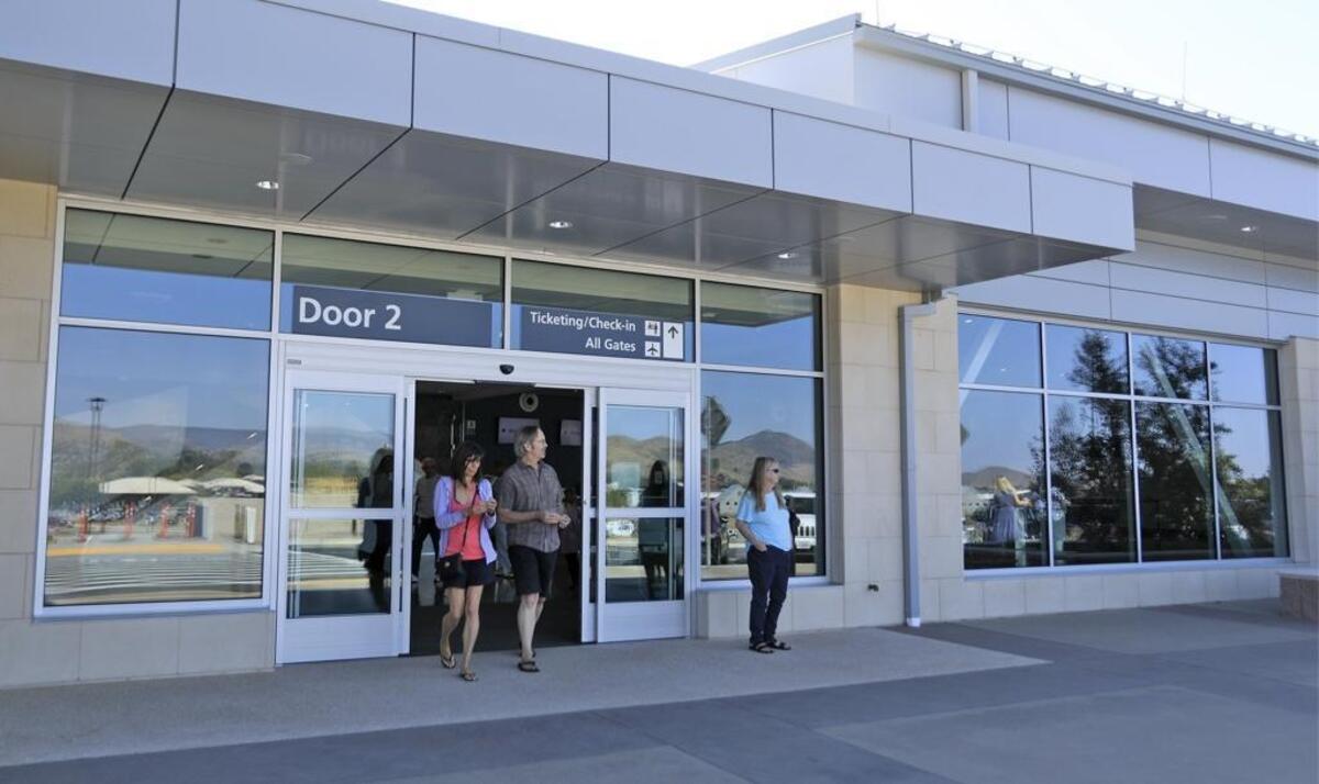 2017: People walk out of the front entrance of the new San Luis Obispo County Regional Airport terminal during a preview in October. It opens Nov. 1, 2017.