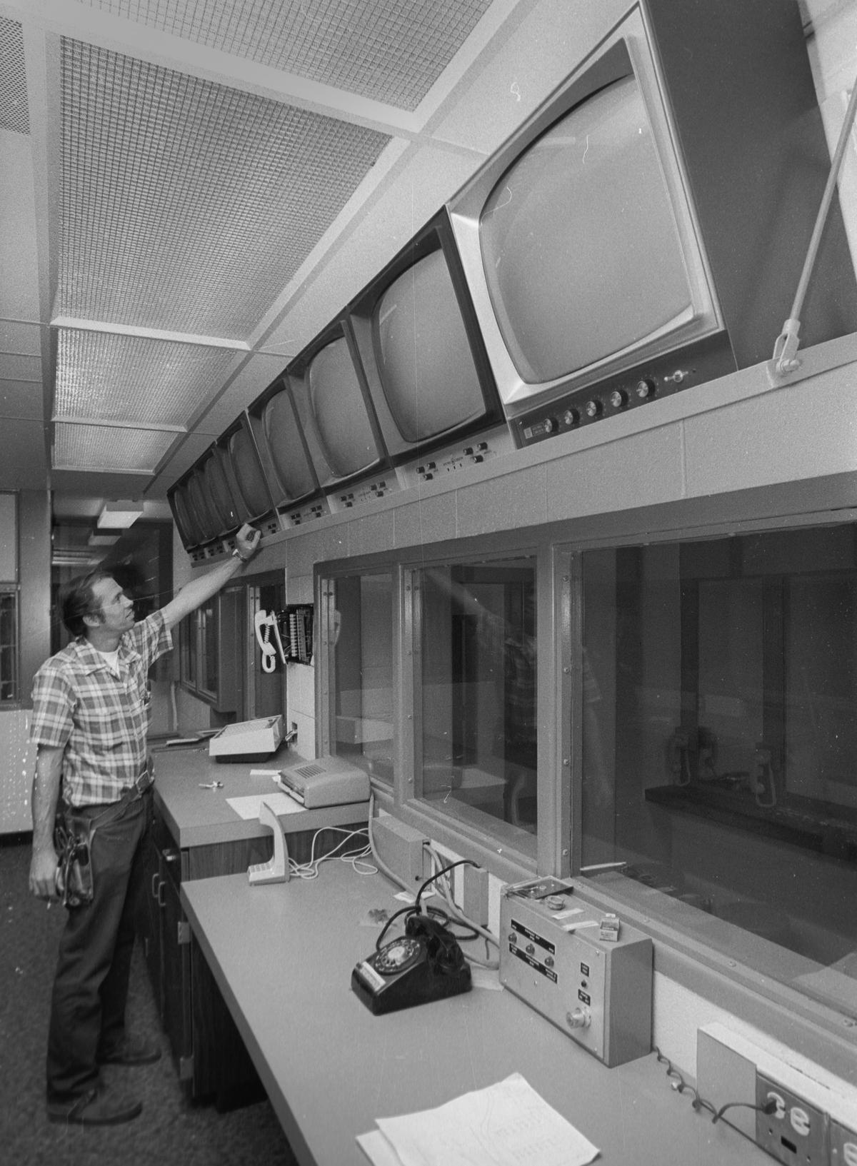 John Hamilton, an installer with Suppliers Inc., adjust one of the bank of closed-circuit television monitors that will help deputies keep a constant eye on things at the new San Luis Obispo County Jail, built for about $1.3 million. The jail moved from downtown San Luis Obispo to Kansas Avenue in October 1971.