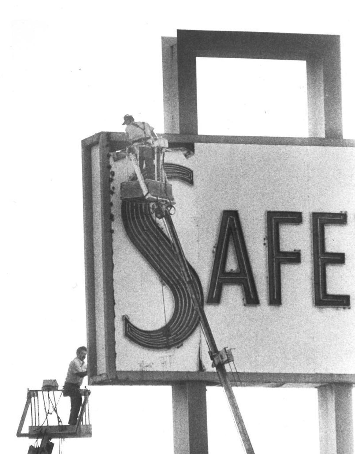 Workers dismantle the San Luis Obispo Safeway sign in September 1988. Built in 1956, it was 45 feet tall and 300 square feet in area.