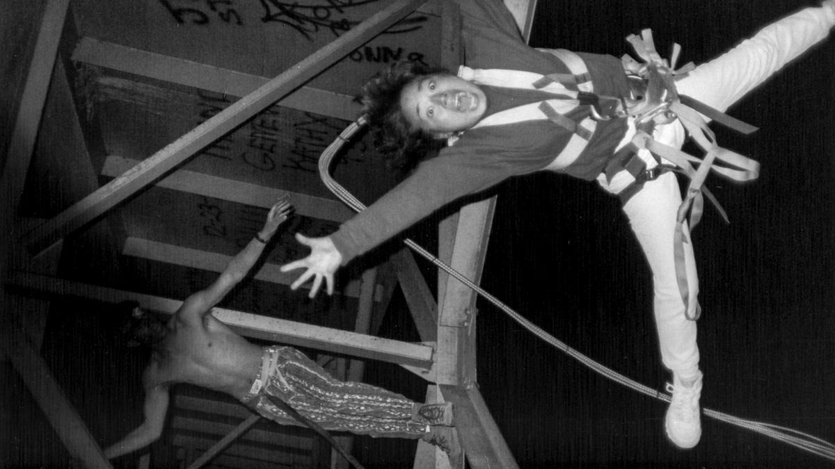 Marilyn Higa dives from a San Luis Obispo County bridge as an intentionally obscured “Mr. Bungee” coaches her in 1991.