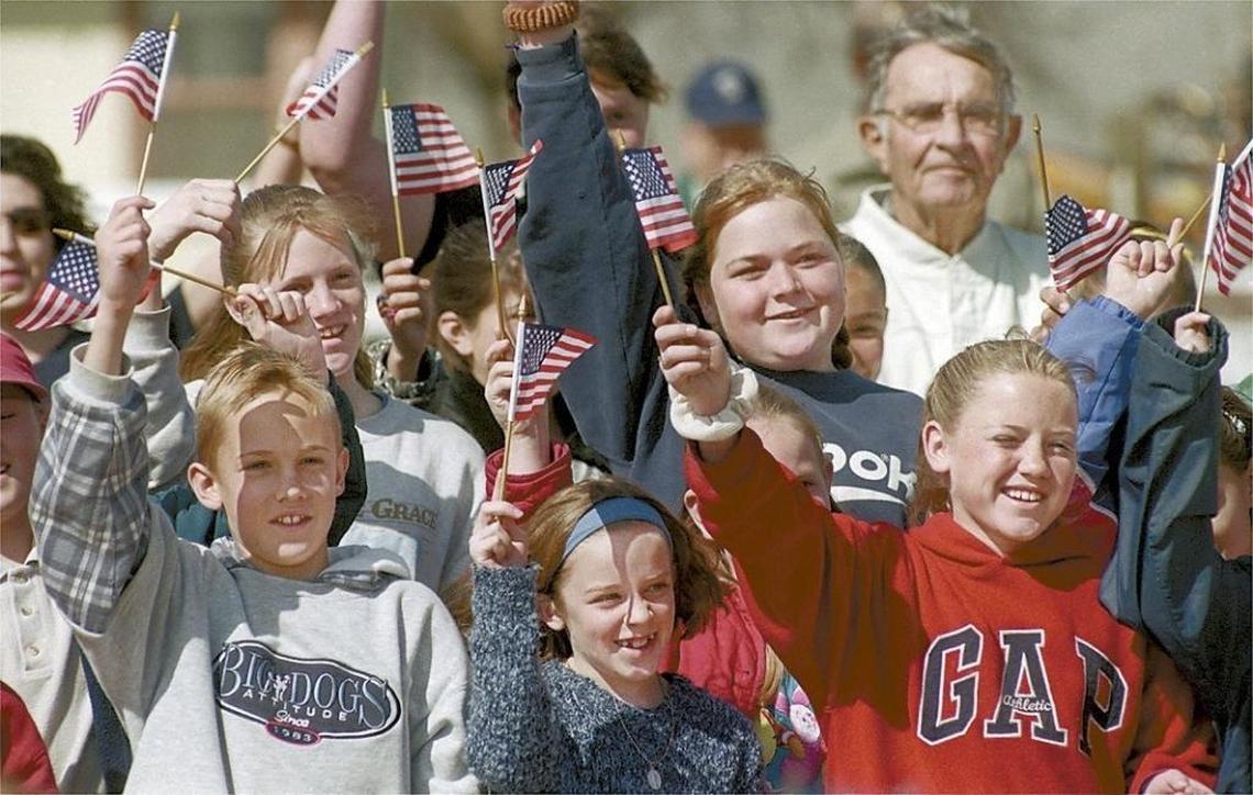 Carrisa Plains Elementary School students wave flags at the ceremony held at the Goodwin Education Center March 1999.