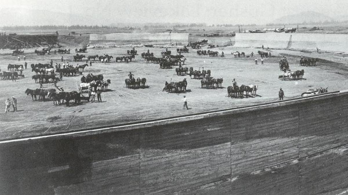 Construction of the massive Union Oil reservoirs on Tank Farm Road in 1910. In the era before diesel fired bulldozers, 300 teamsters were required to run the horse teams excavating 80,000 cubic yards of earth from each reservoir. Each reservoir cost $250,000 (about $6,000,000 in 2016 dollars.) The roof on the largest reservoir could have covered Spanos Stadium.