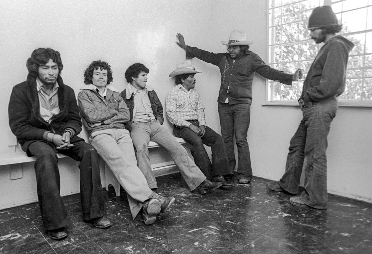 Six undocumented immigrants, caught after a train check, wait in San Luis Obispo’s Border Patrol office. They’ll spend a night in jail before returning to Mexico.