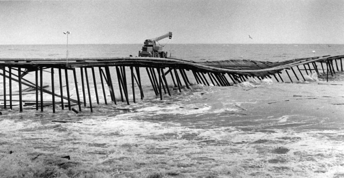 The Union Oil pier in Avila Beach collapses into the surf on the afternoon of March 1, 1983 after pounding waves undermined its pilings. Three men were thrown in to the surf and later rescued.