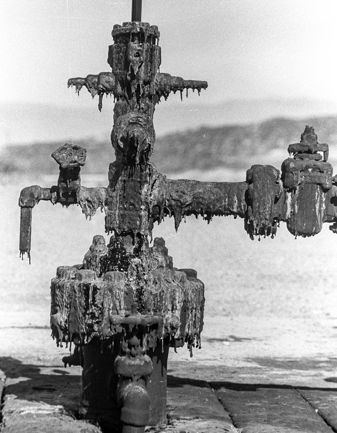 A pump is covered with oil at a Unocal oil field in the Guadalupe Dunes in 1989. The field was shut down in 1994 because a chemical used to help extract the thick, asphalt-like oil was contaminating nearby areas.