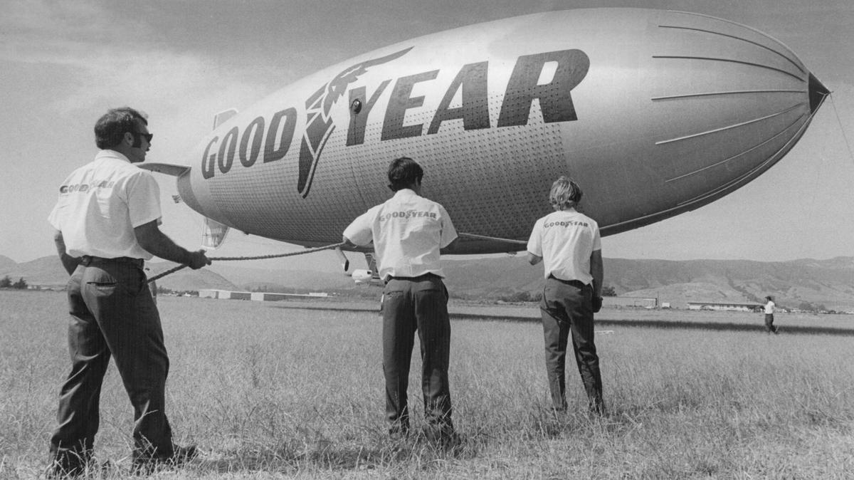 Ground crew helps control Goodyear blimp Columbia, after landing at San Luis Obispo County Regional Airport in August 1975.
